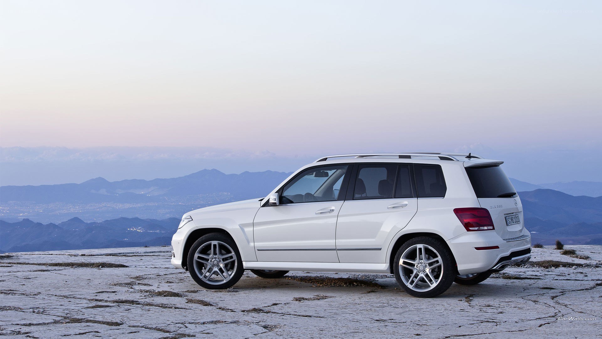 white suv on mountain peak