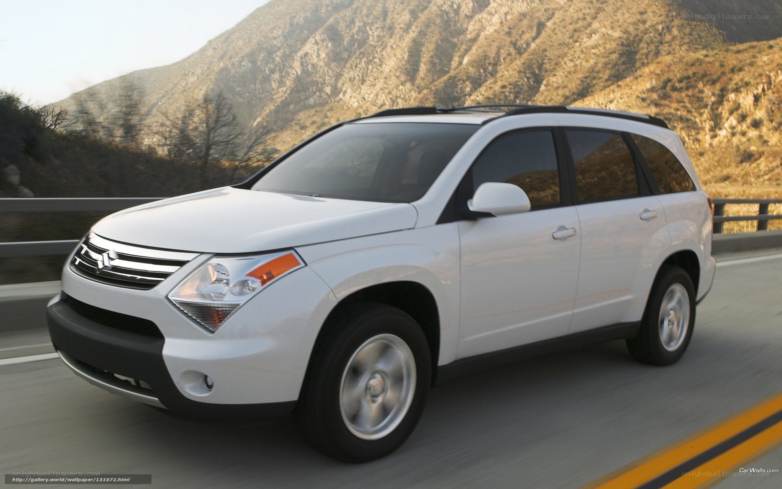 white suv on mountain road