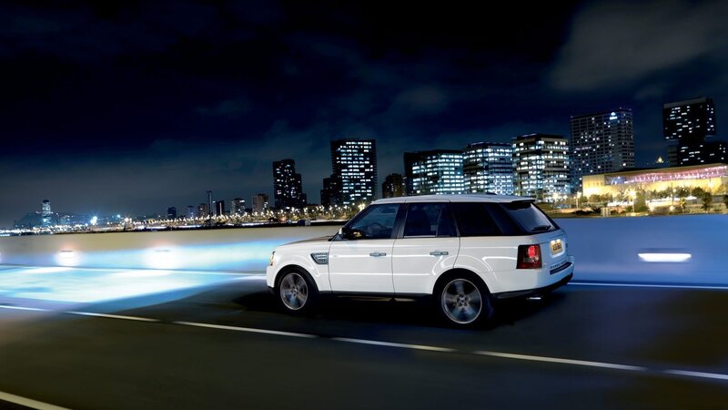 White Suv on Road — Dramatic, Night, Photograph, City Skyline