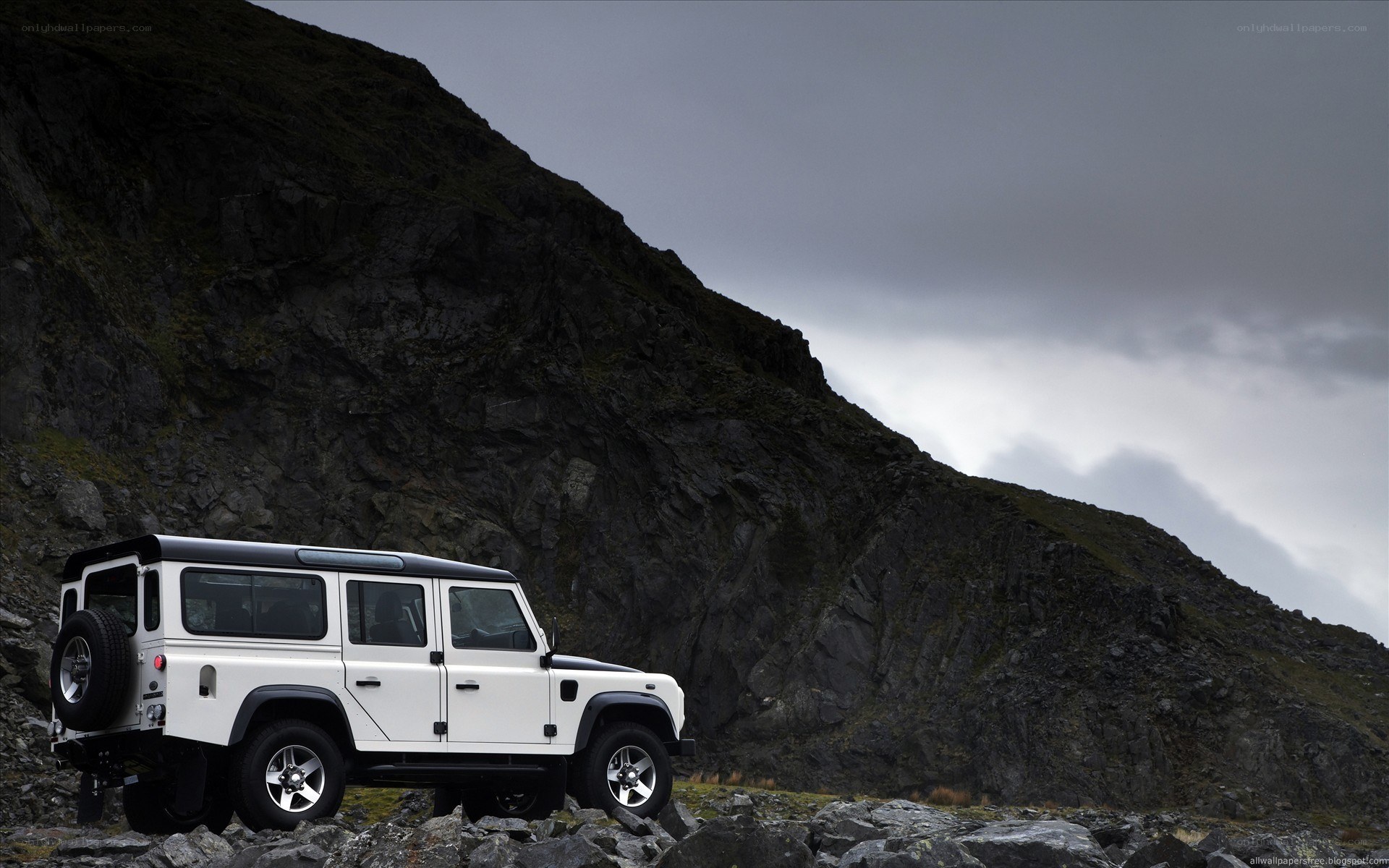 White SUV on rocky terrain