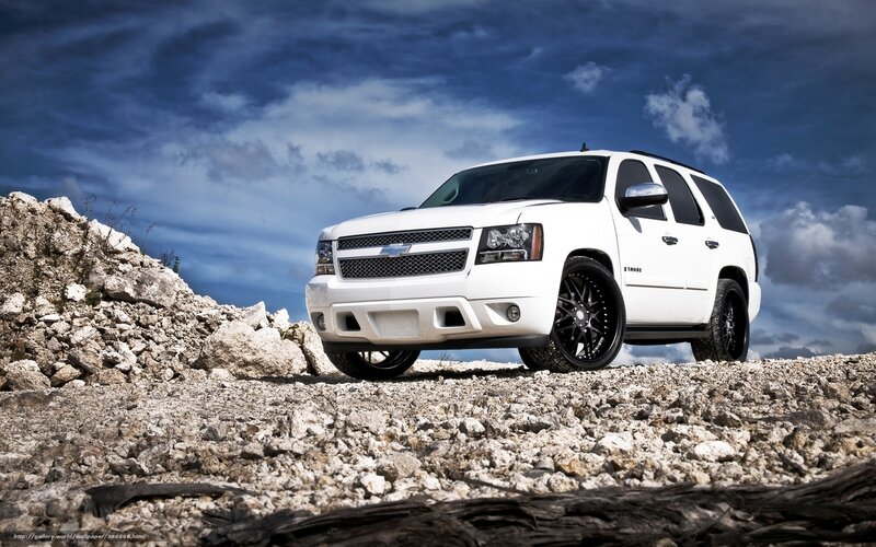 White SUV on rocky terrain
