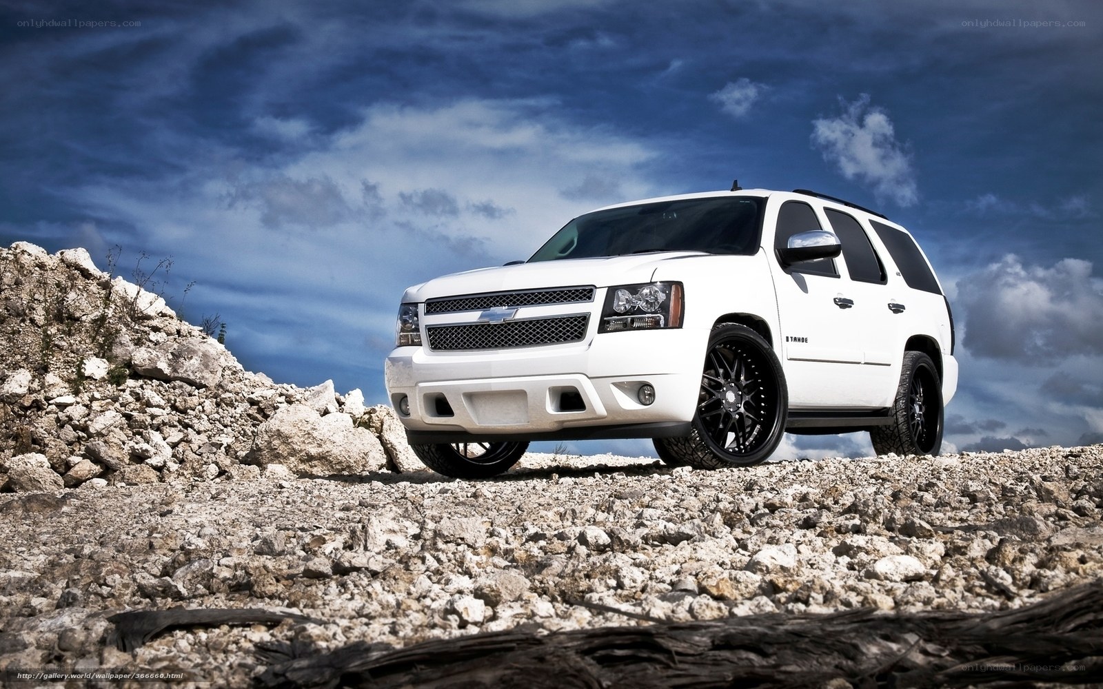 White SUV on rocky terrain