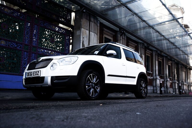White SUV parked in urban alley