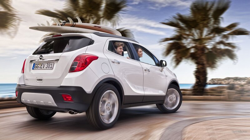 White Suv with Surfboard