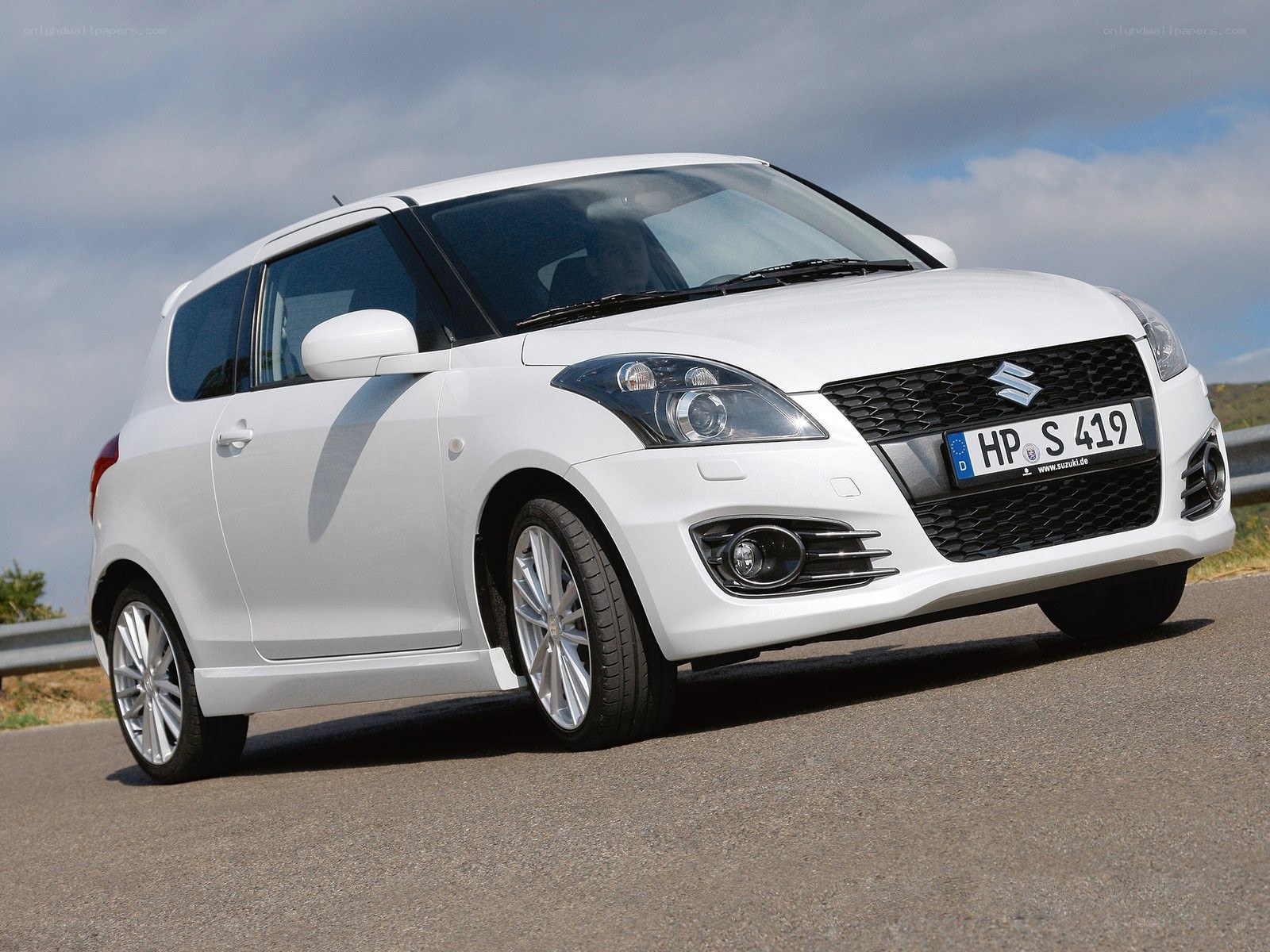white suzuki swift car