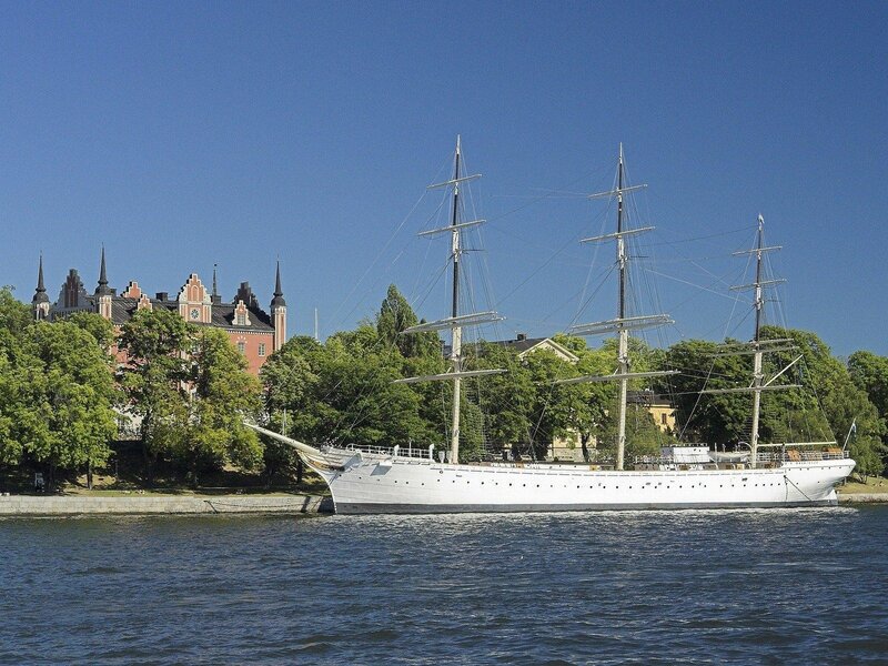 White tall ship in harbor