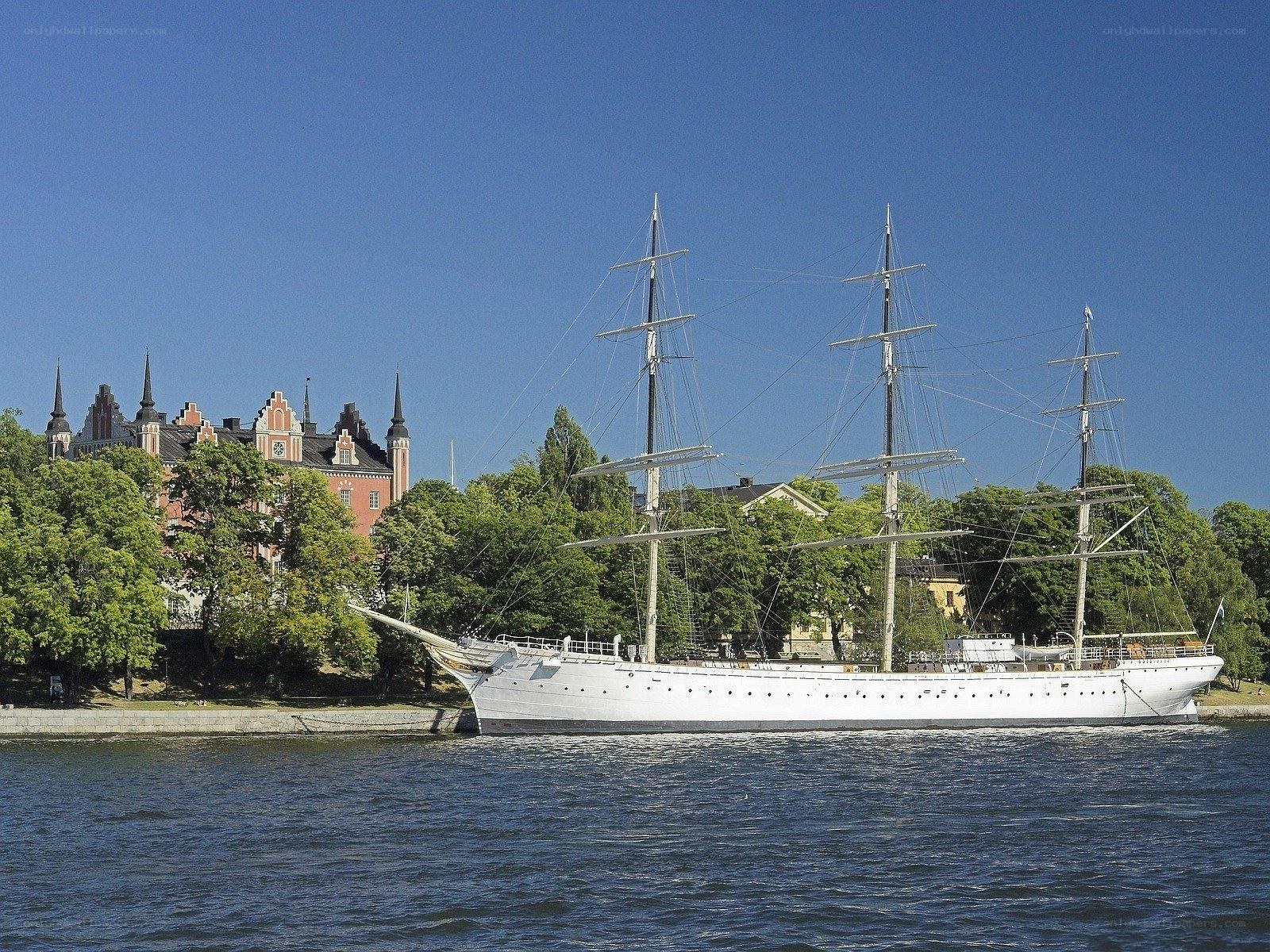 White tall ship in harbor