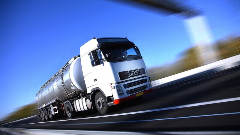 White tanker truck on highway