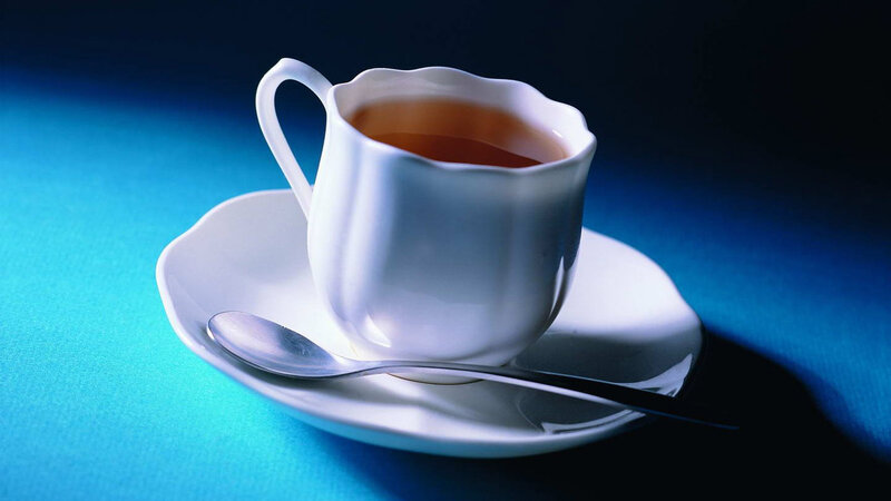 White Teacup on Saucer — Blue