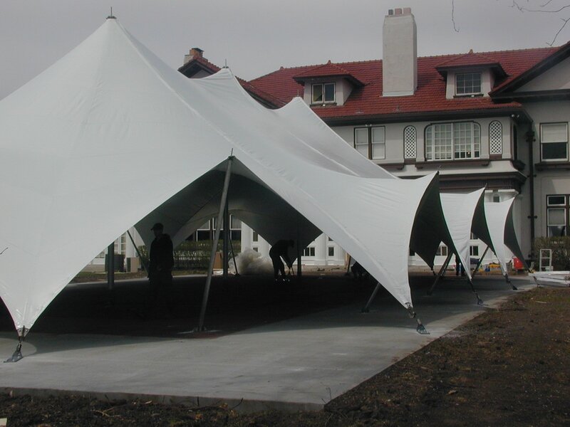 White tents set up outside a building