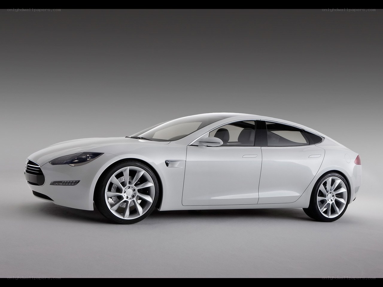 White Tesla sedan in studio