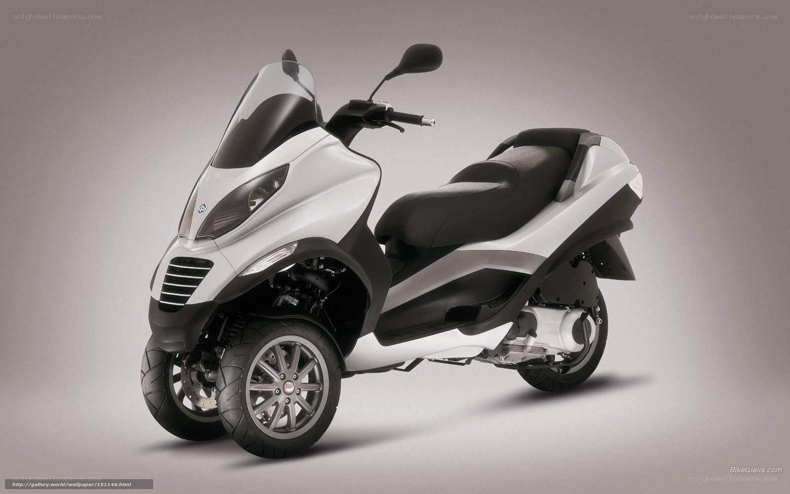 white three-wheeled scooter