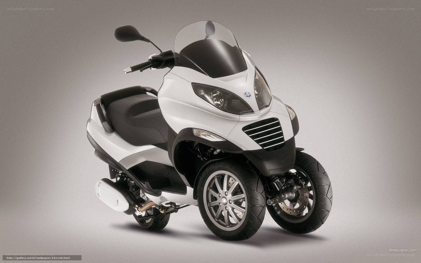 white three-wheeled scooter