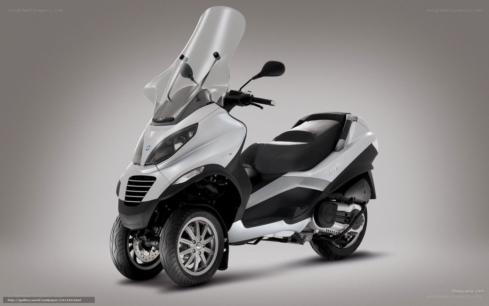 white three-wheeled scooter