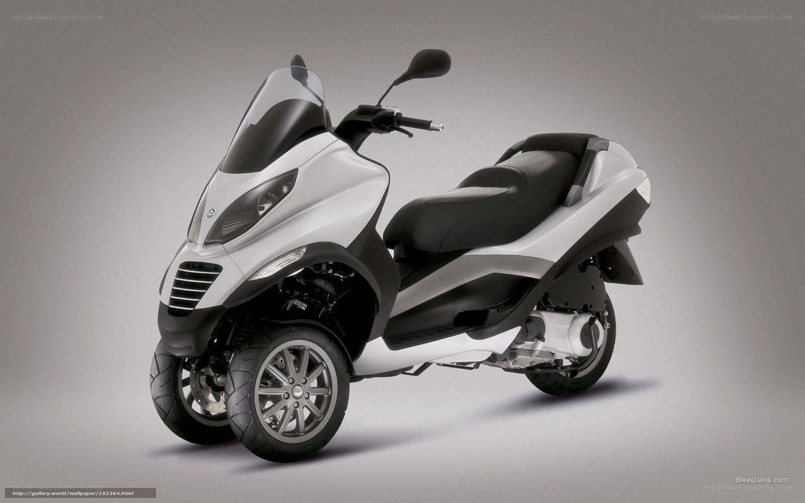 white three-wheeled scooter