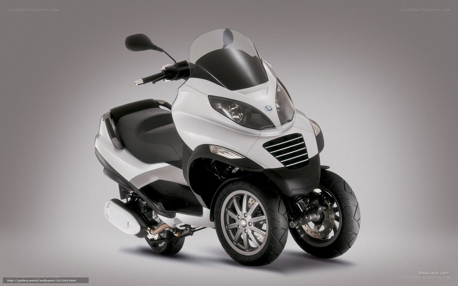 white three-wheeled scooter