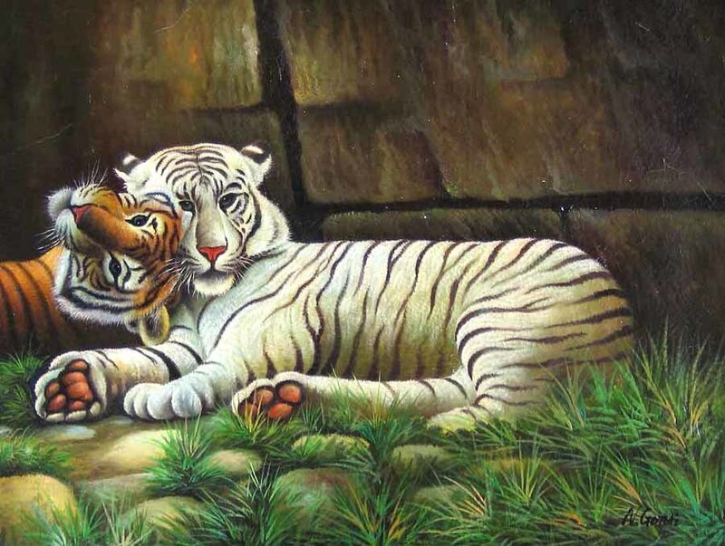 White tiger with cub resting