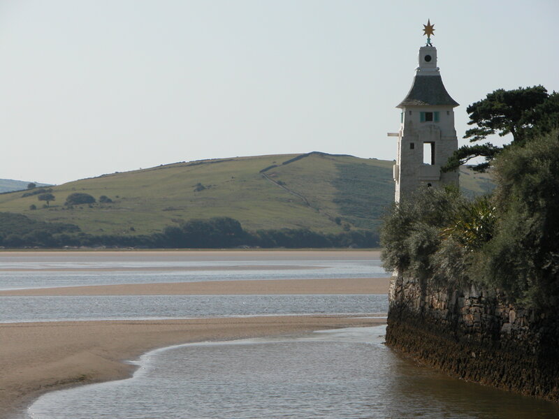 White tower by the river