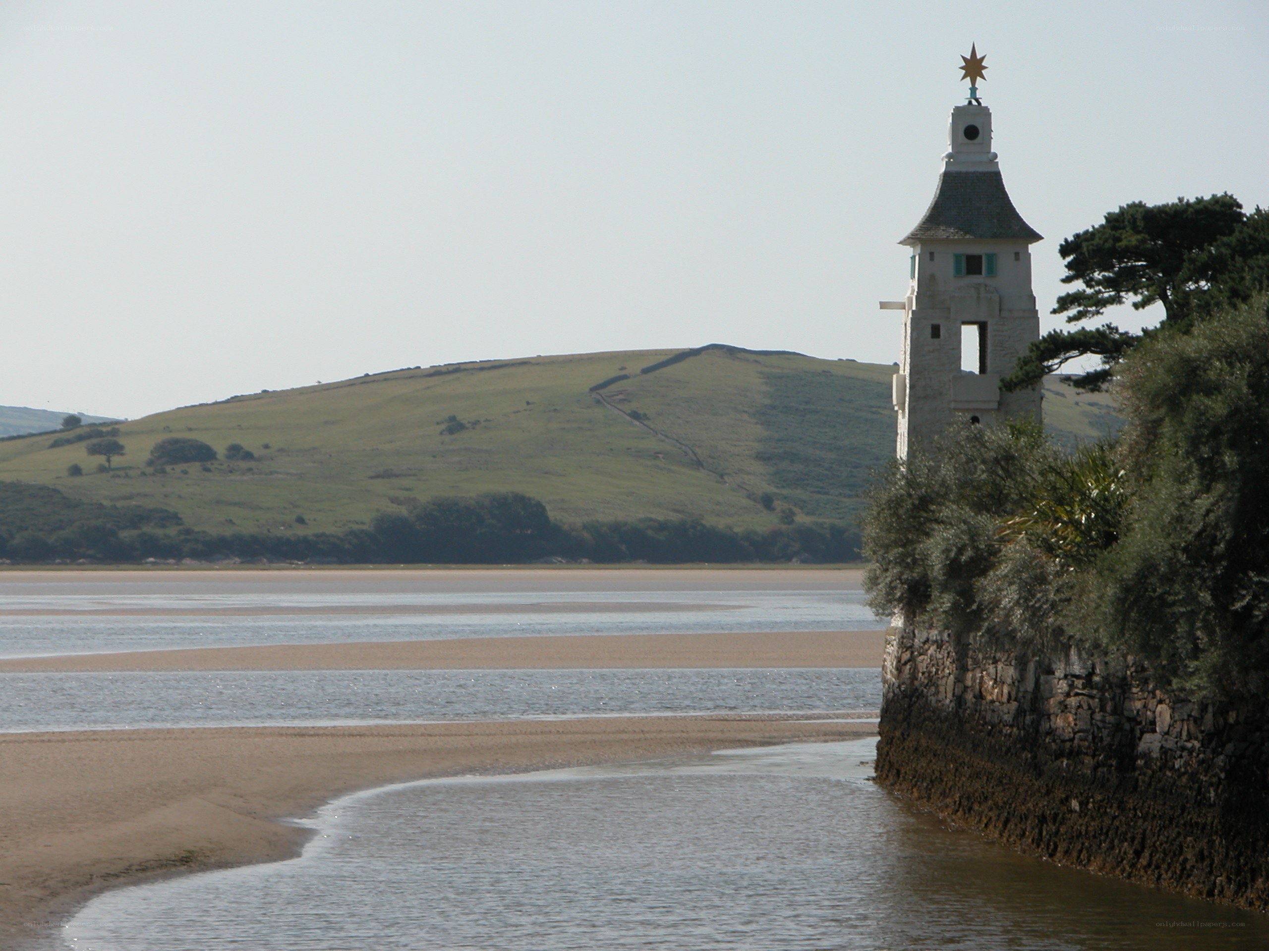 White tower by the river