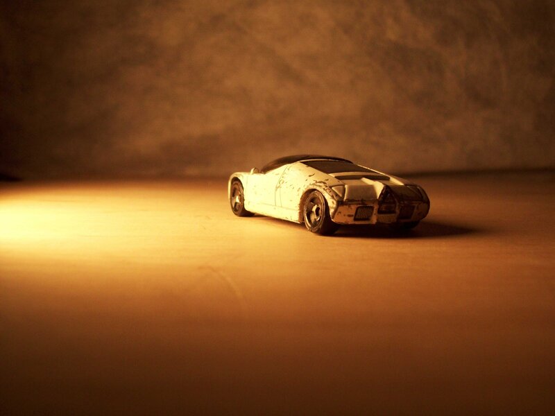 white toy car in warm light