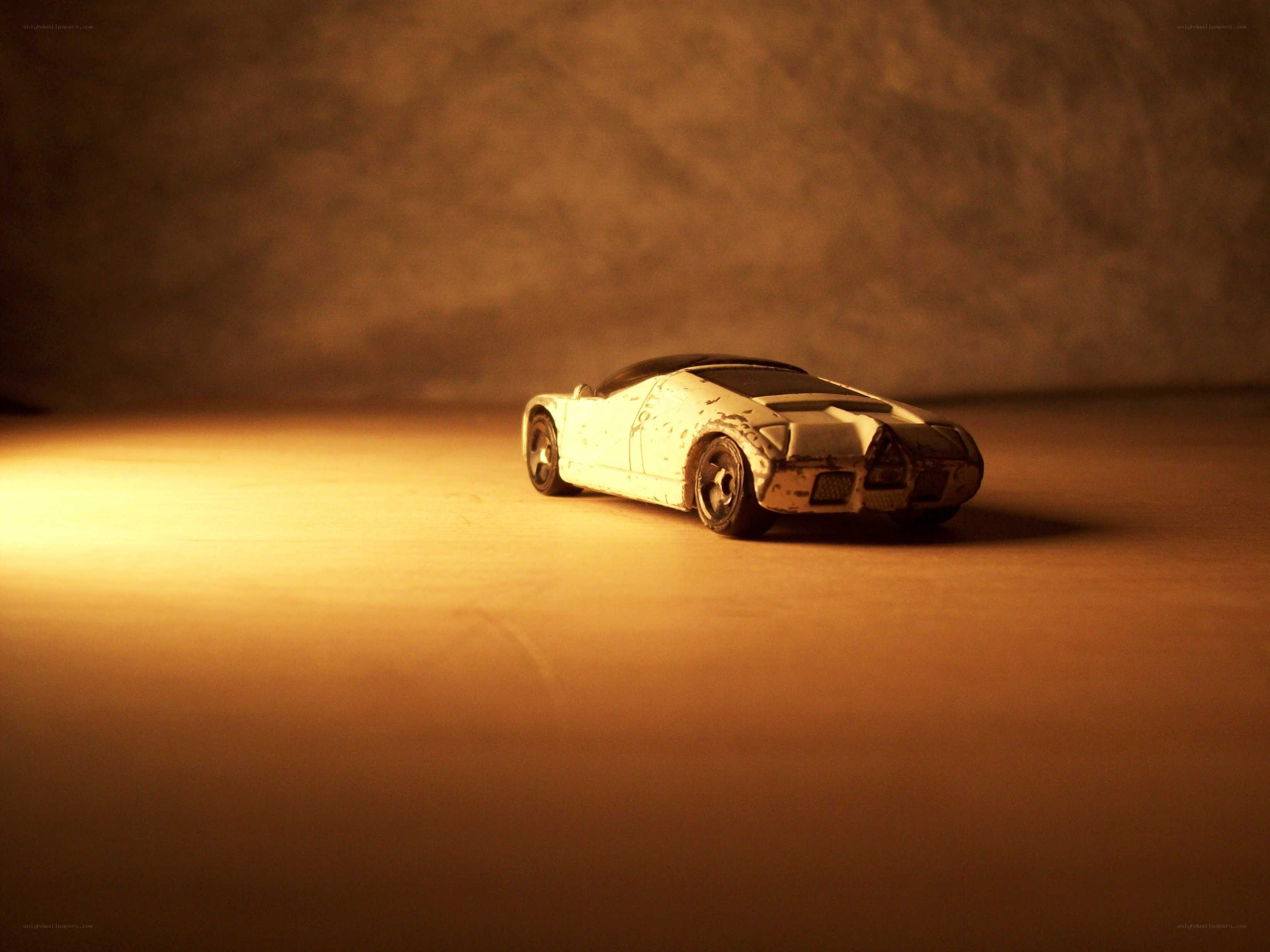 white toy car in warm light