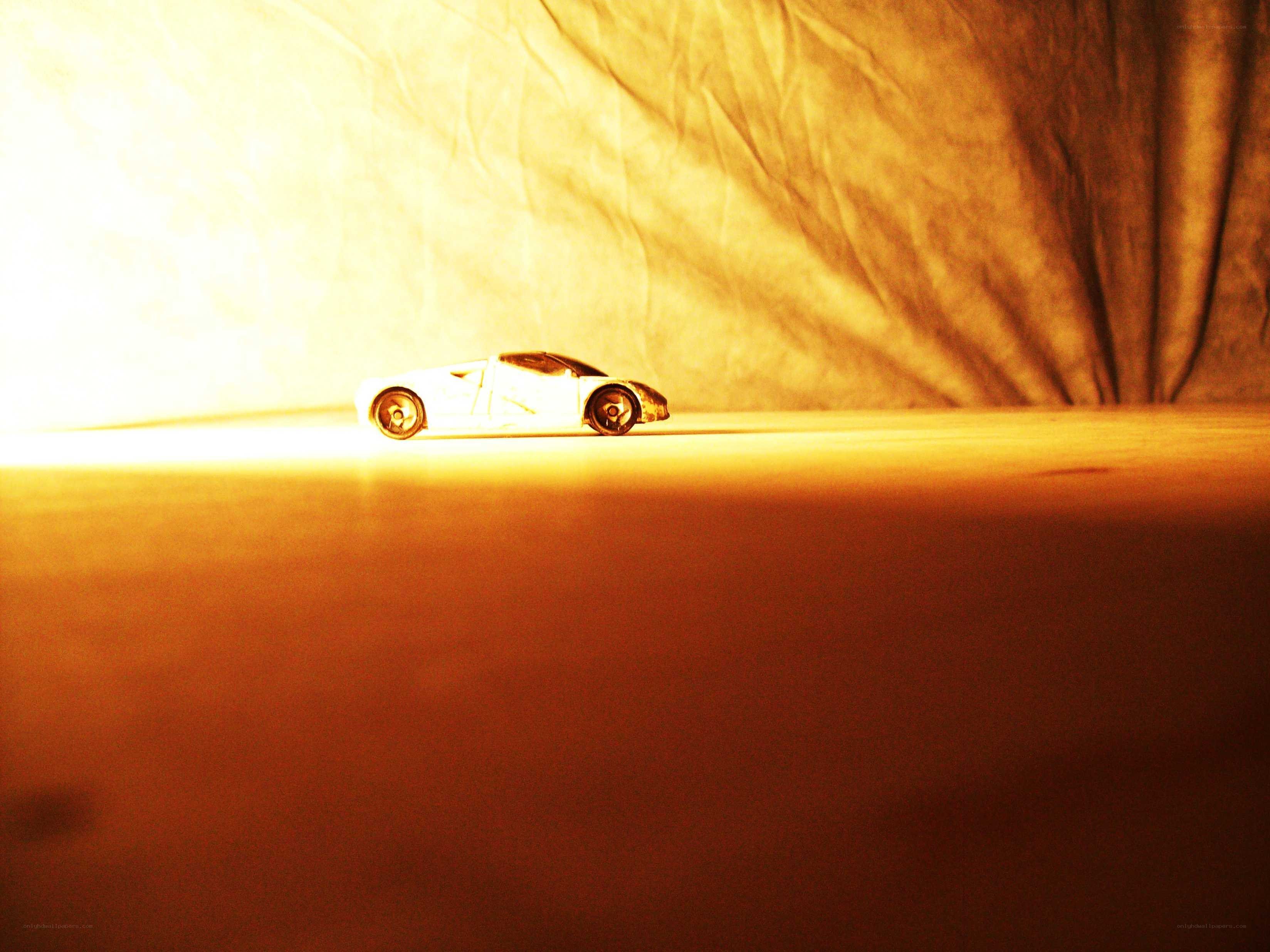 white toy car on surface