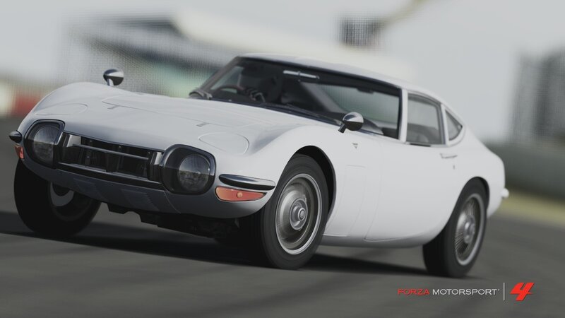 White Toyota 2000GT on a racetrack