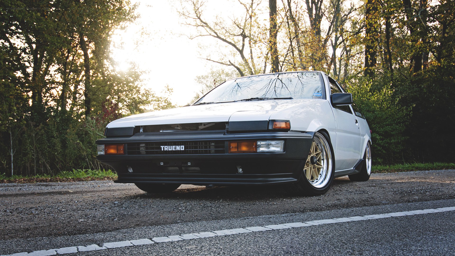 white toyota ae86 on road