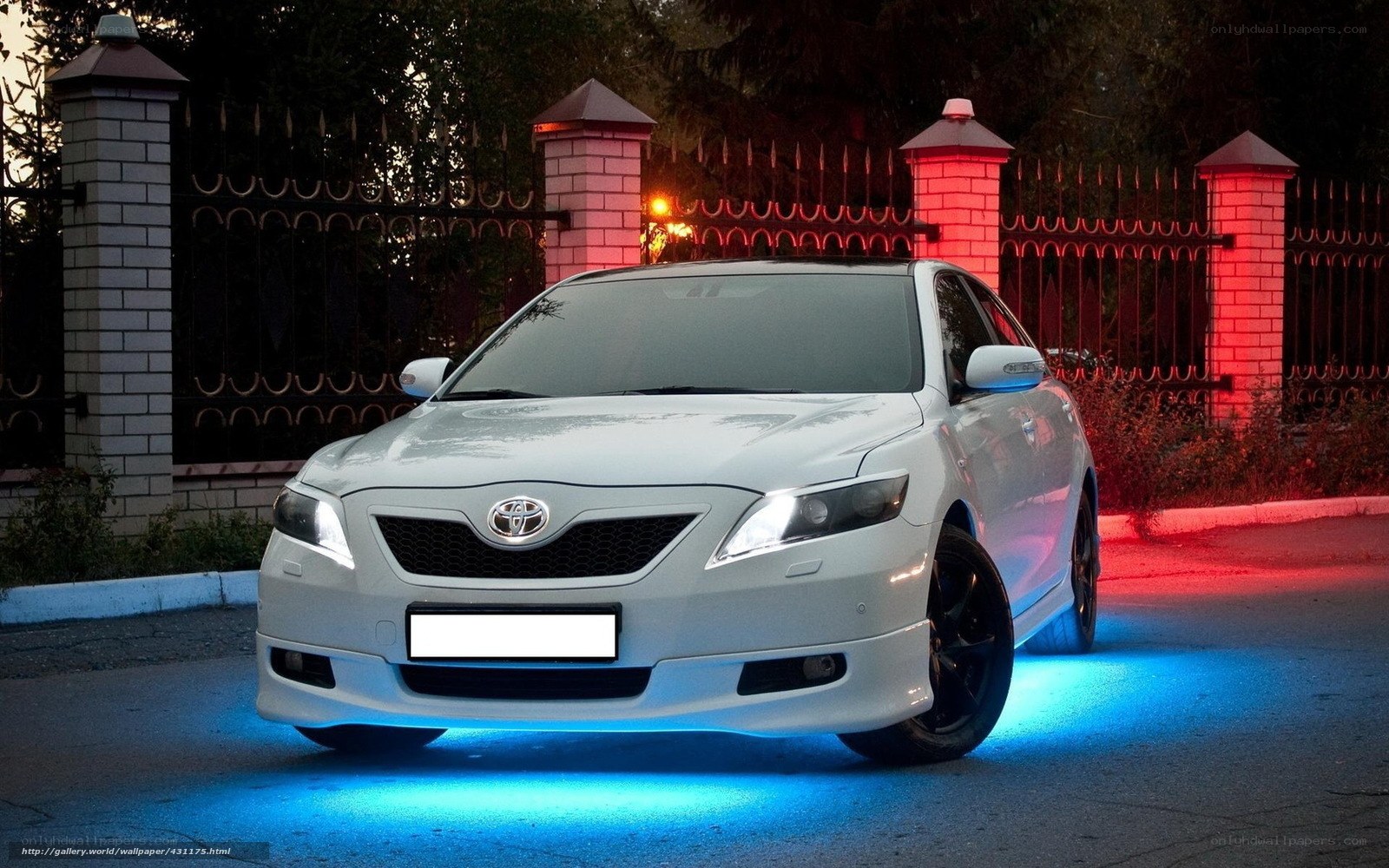 White Toyota Camry at night