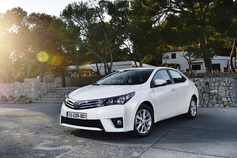 White Toyota Corolla — Serene