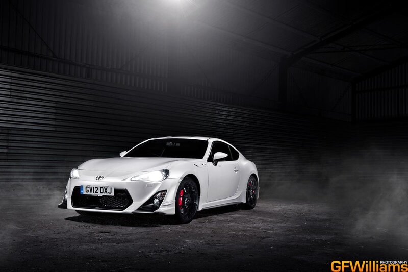 White Toyota GT86 in a dark garage