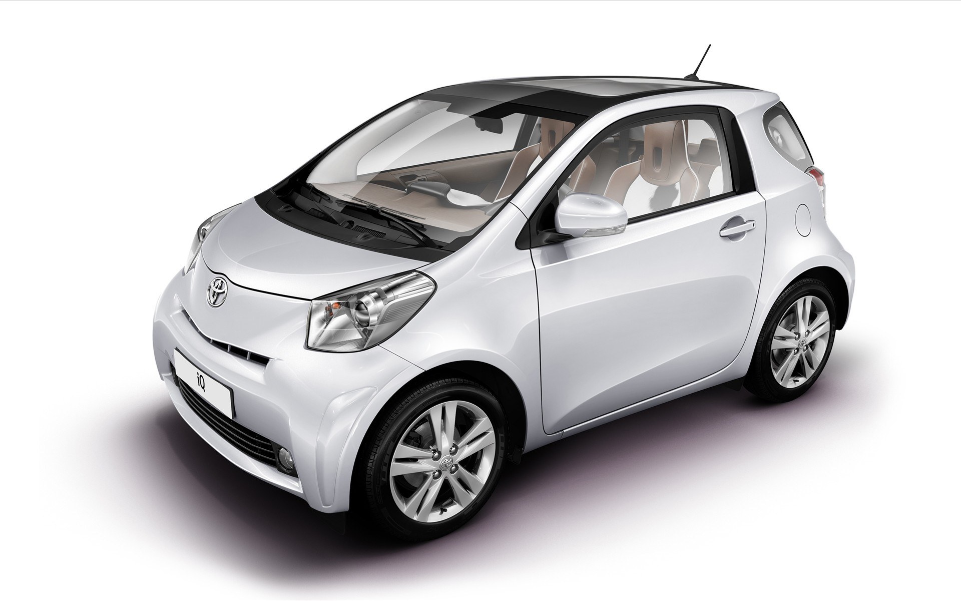 White Toyota iQ compact car