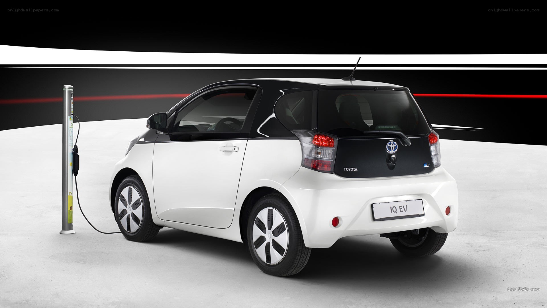 White Toyota iQ EV charging