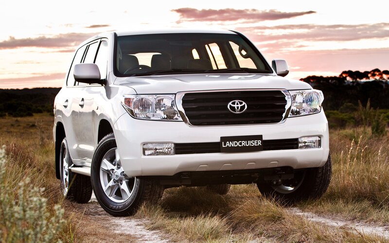 White Toyota Land Cruiser in field