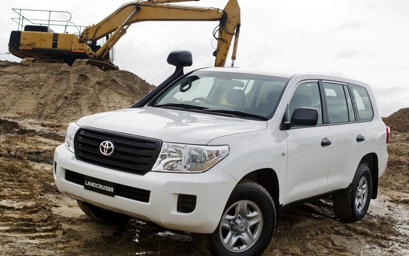 White Toyota Land Cruiser on construction site
