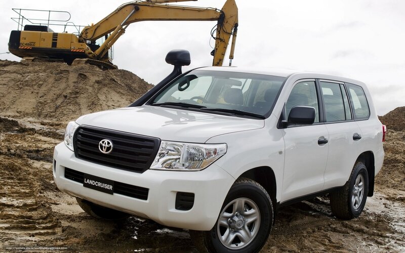 White Toyota Land Cruiser on construction site