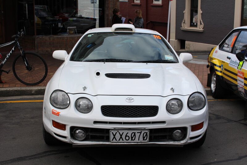 White Toyota rally car on street