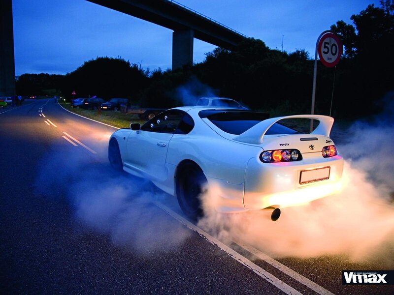 White Toyota Supra drifting at night