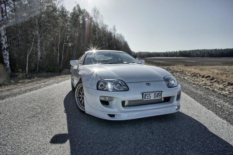 White Toyota Supra on a country road