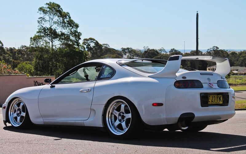 White Toyota Supra with rear wing