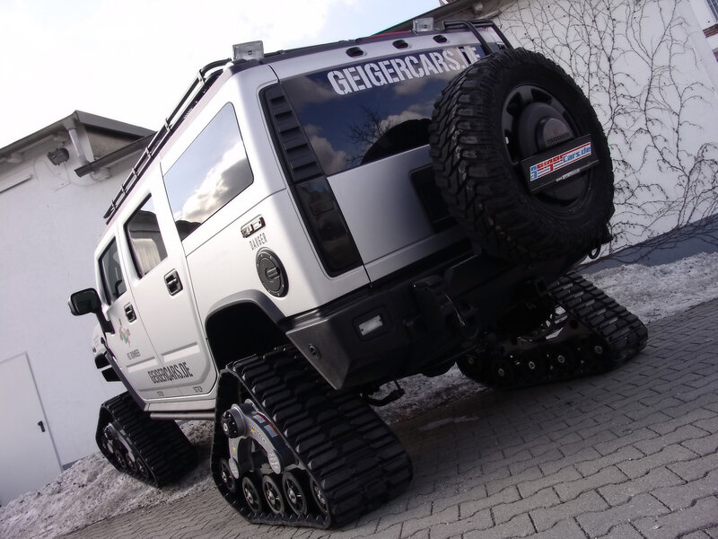 white tracked vehicle on pavement