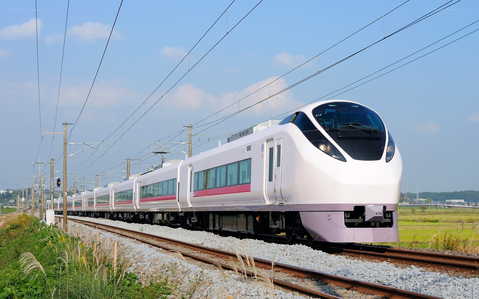 White train on railway tracks