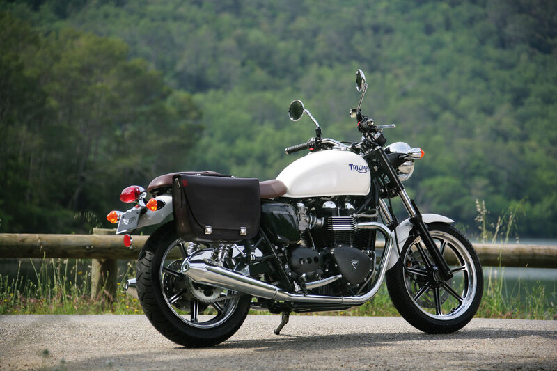White Triumph motorcycle on road