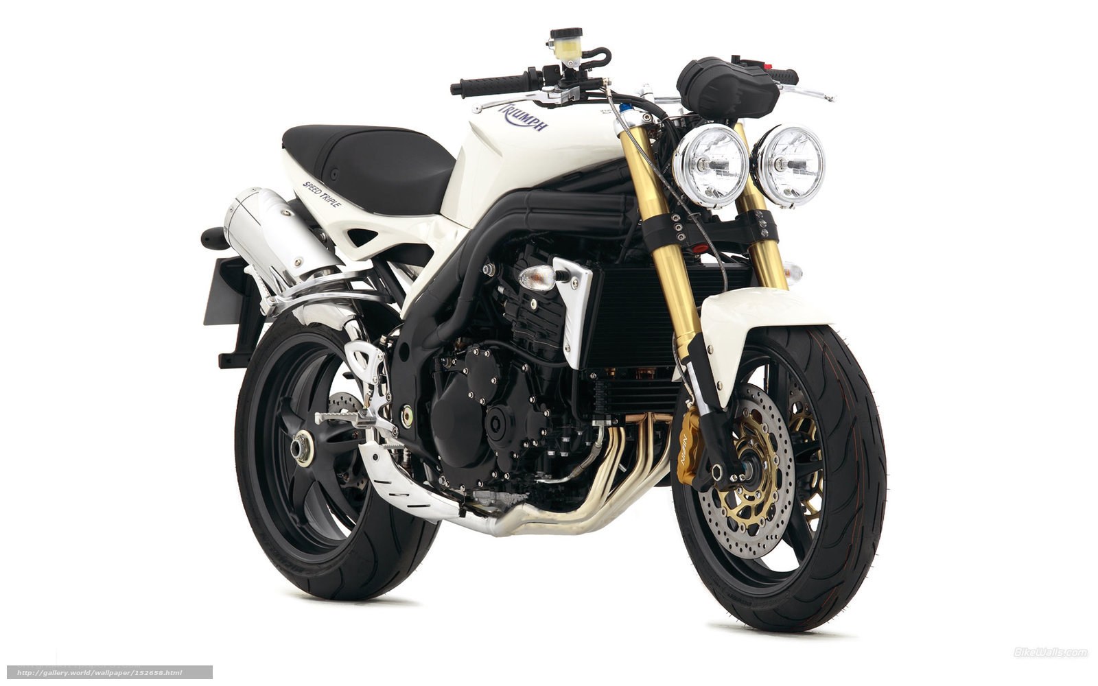 white triumph speed triple motorcycle