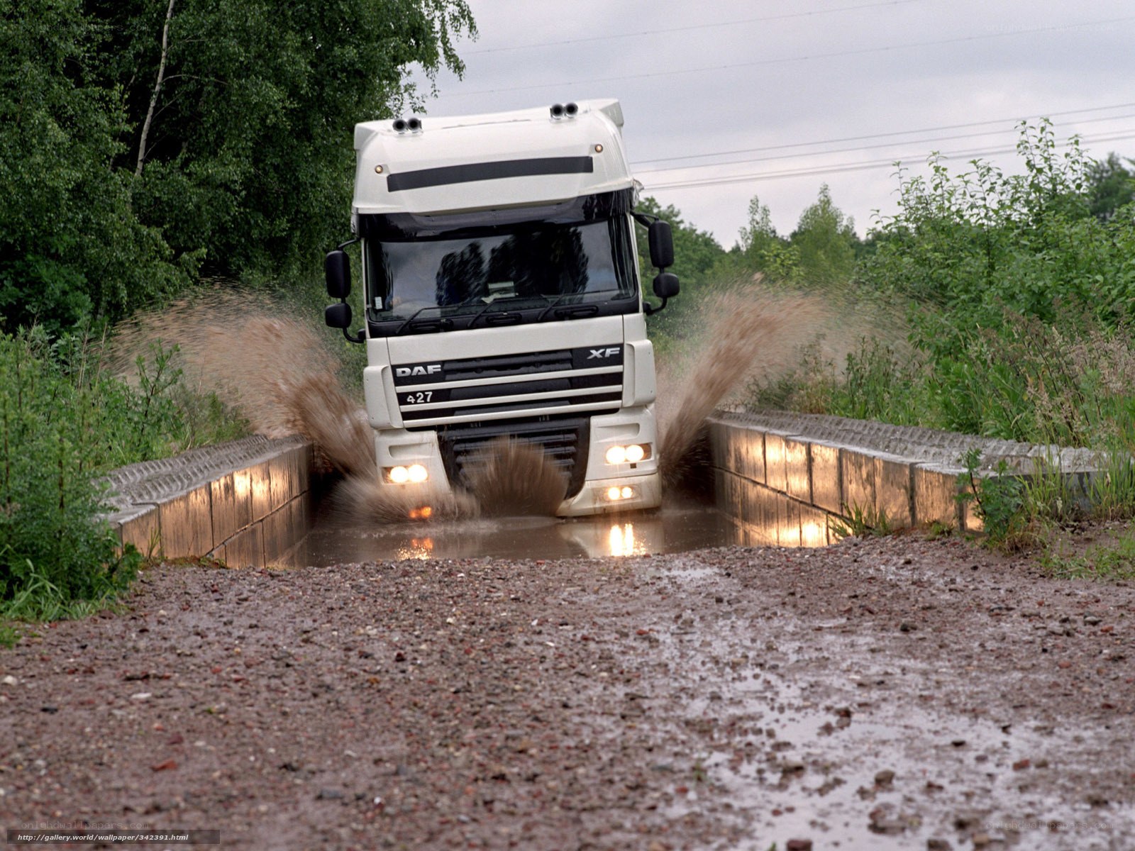 White truck driving through water
