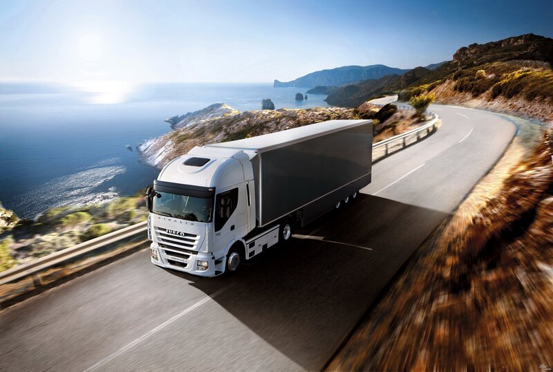 White truck on coastal road