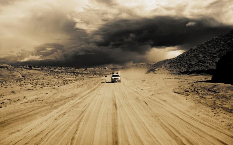 White Truck on Dirt Road — Brown, Dramatic, Photograph