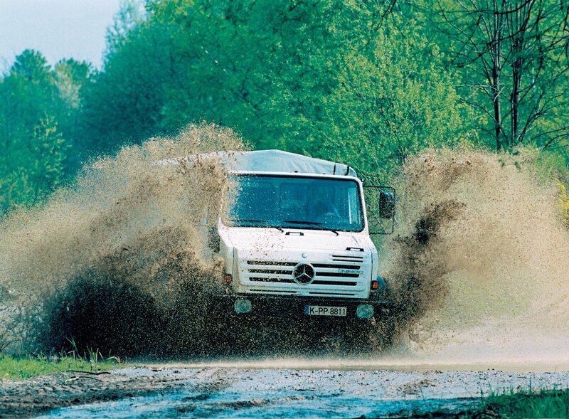White truck splashing mud