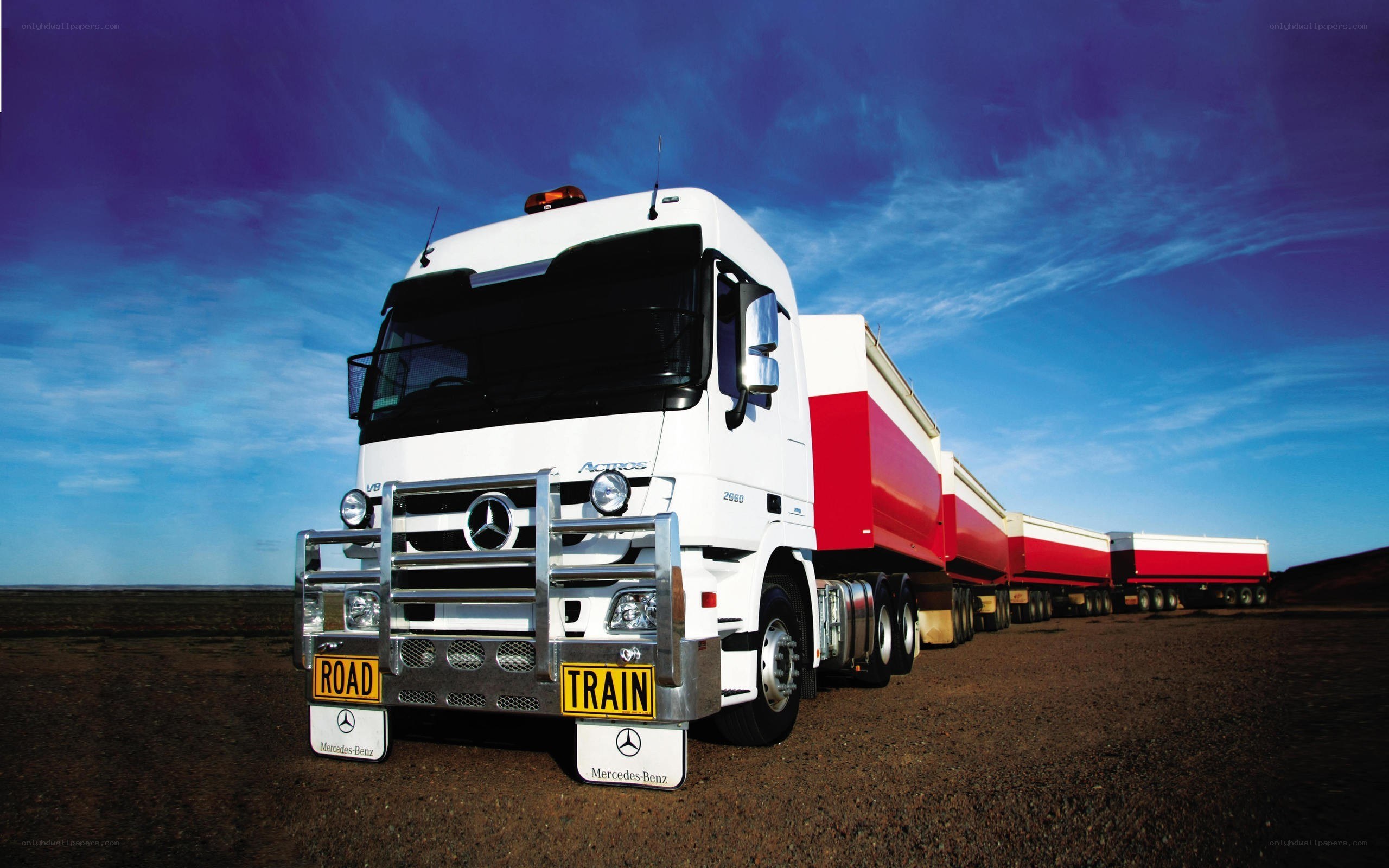 White truck with red trailers