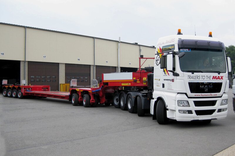 White truck with red trailers